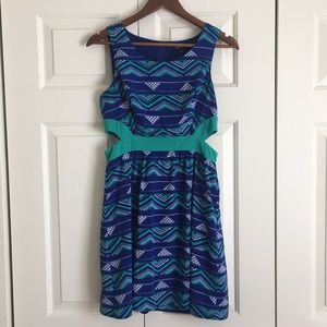 Dress with geometric pattern and side cut outs